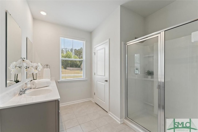 238 Sage Field Dr, Rincon, GA 31326 - full bath featuring a shower stall, tile patterned floors, baseboards, and double vanity