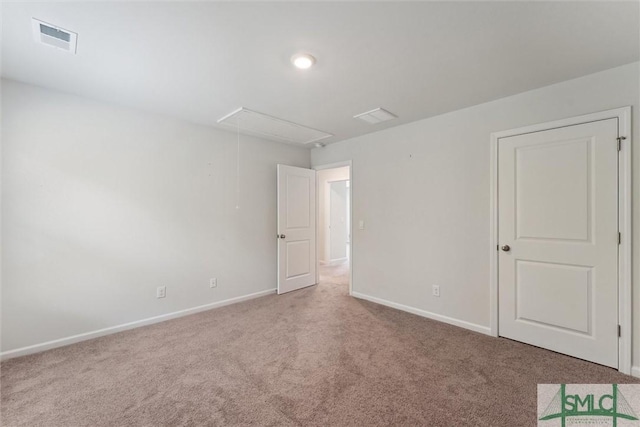 238 Sage Field Dr, Rincon, GA 31326 - carpeted spare room featuring attic access and baseboards