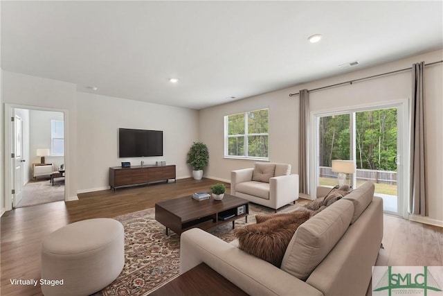 238 Sage Field Dr, Rincon, GA 31326 - living area featuring wood finished floors, baseboards, and recessed lighting