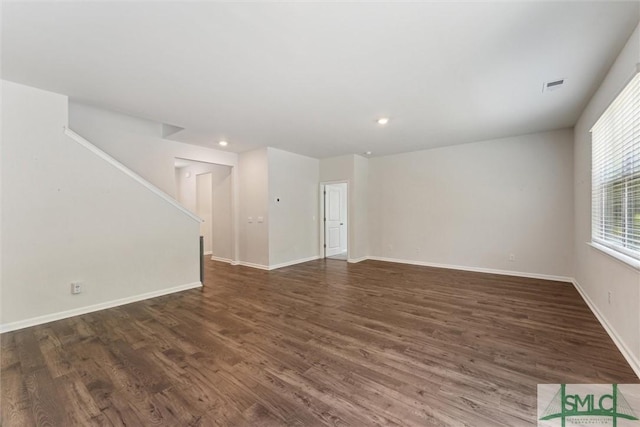 238 Sage Field Dr, Rincon, GA 31326 - unfurnished living room with dark wood finished floors, stairs, baseboards, and recessed lighting