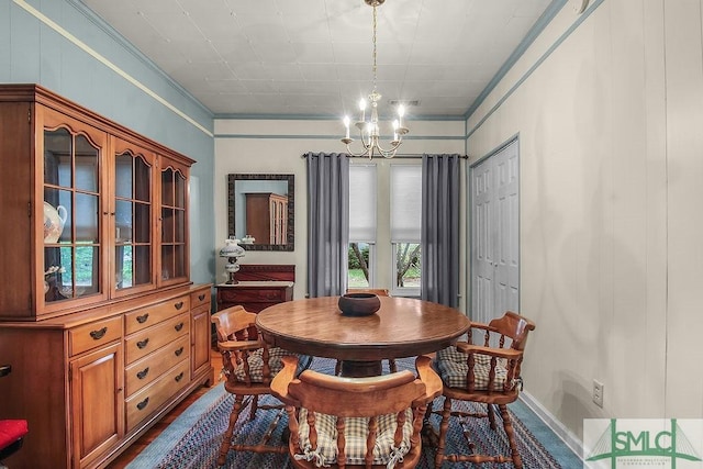 8 Georgia St, Pembroke, GA 31321 - dining room featuring a chandelier, ornamental molding, and baseboards