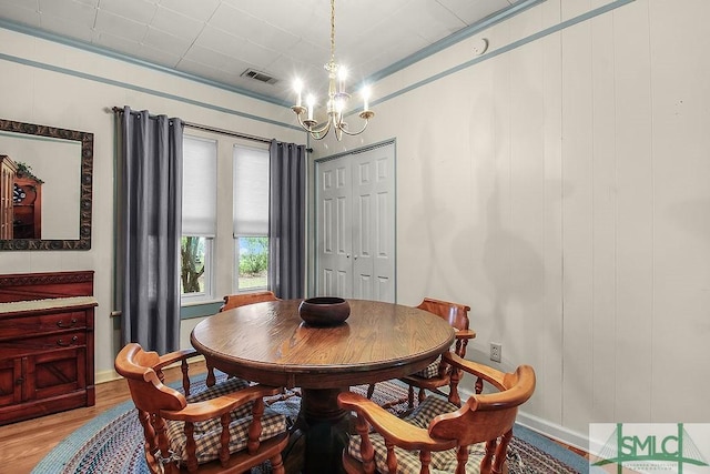 8 Georgia St, Pembroke, GA 31321 - dining area featuring light wood-style floors, baseboards, and a chandelier
