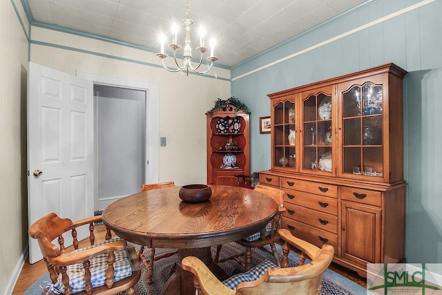 8 Georgia St, Pembroke, GA 31321 - dining room with a chandelier, crown molding, and light wood-type flooring