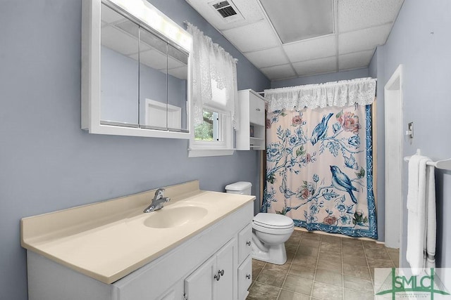8 Georgia St, Pembroke, GA 31321 - full bathroom featuring toilet, vanity, a shower with curtain, and a paneled ceiling