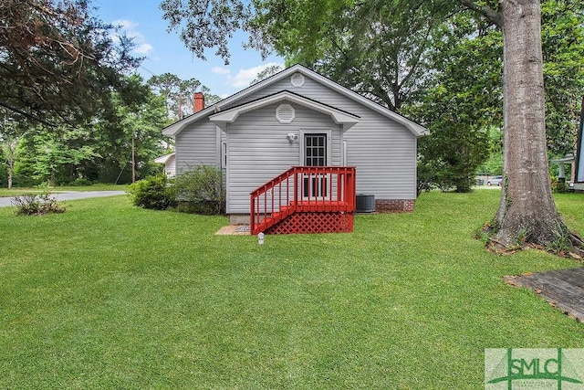 8 Georgia St, Pembroke, GA 31321 - view of front of property featuring a front yard, a chimney, and central AC