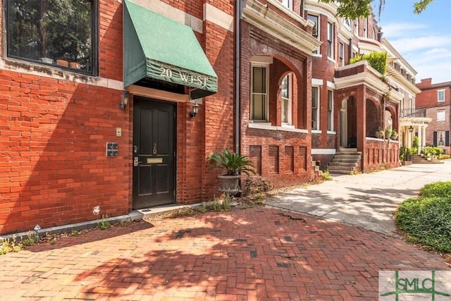 20 W Oglethorpe Ave Unit D, Savannah, GA 31401 - view of exterior entry with brick siding