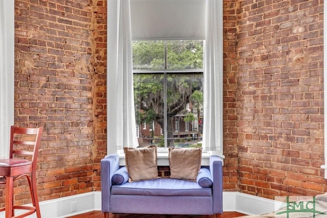 20 W Oglethorpe Ave Unit D, Savannah, GA 31401 - living area featuring brick wall