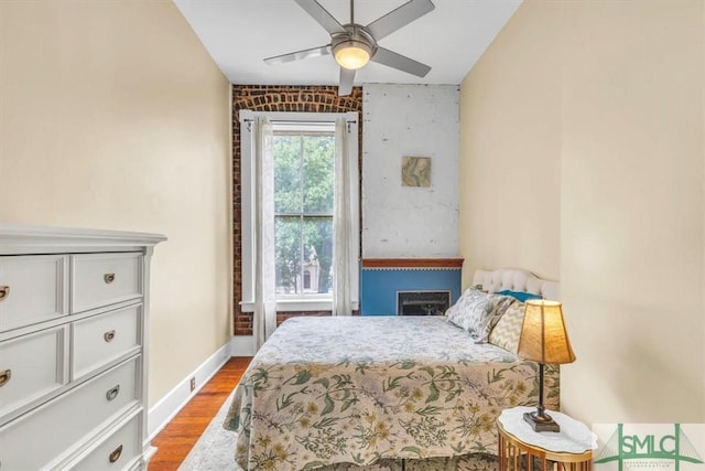 20 W Oglethorpe Ave Unit D, Savannah, GA 31401 - bedroom featuring wood finished floors, baseboards, and a ceiling fan