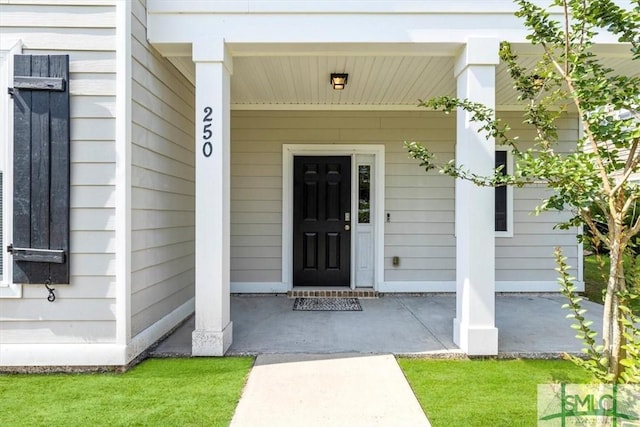 250 James Dunham Pkwy, Richmond Hill, GA 31324 - doorway to property with covered porch