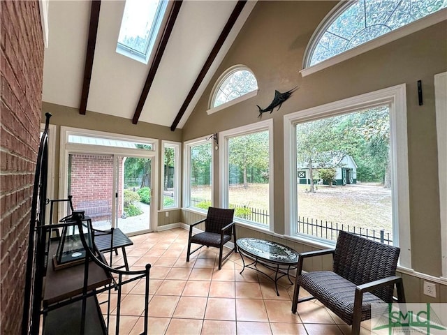 sunroom / solarium featuring high vaulted ceiling, a skylight, beam ceiling, and tile patterned floors