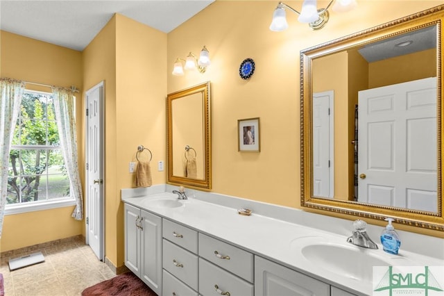 330 Central Ave, Guyton, GA 31312 - bathroom with double vanity and baseboards