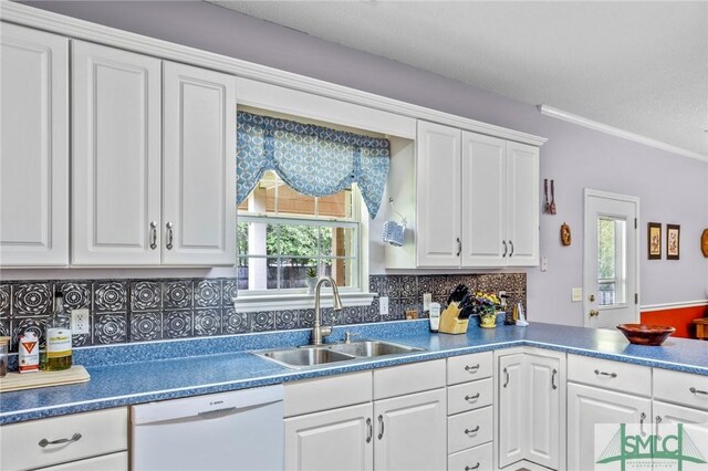 330 Central Ave, Guyton, GA 31312 - kitchen featuring dishwasher, a sink, plenty of natural light, white cabinets, and crown molding