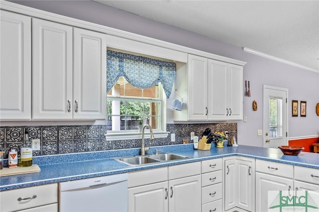 330 Central Ave, Guyton, GA 31312 - kitchen featuring white dishwasher, a sink, plenty of natural light, white cabinetry, and ornamental molding