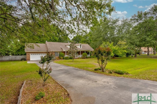 330 Central Ave, Guyton, GA 31312 - view of front of house featuring an attached garage, driveway, and a porch