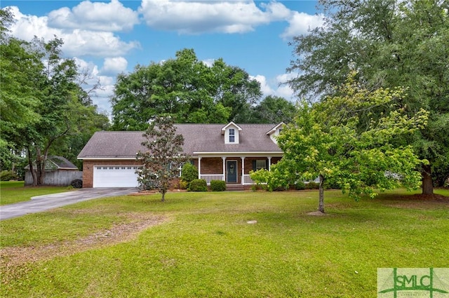 330 Central Ave, Guyton, GA 31312 - cape cod home with a porch, driveway, an attached garage, and a front yard