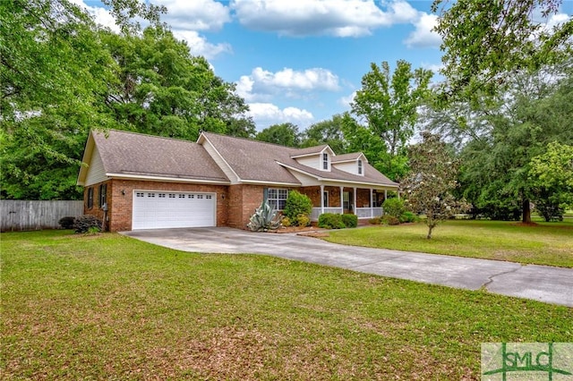 330 Central Ave, Guyton, GA 31312 - cape cod-style house featuring brick siding, concrete driveway, an attached garage, and a porch