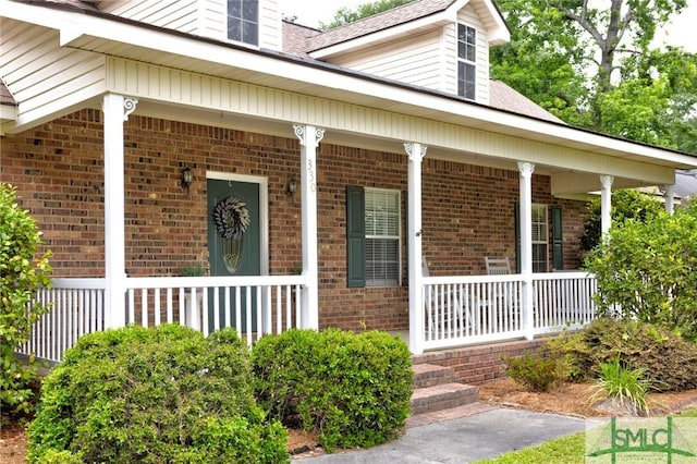330 Central Ave, Guyton, GA 31312 - view of exterior entry with covered porch and brick siding