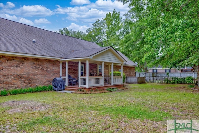 330 Central Ave, Guyton, GA 31312 - rear view of property featuring brick siding, a shingled roof, and a deck