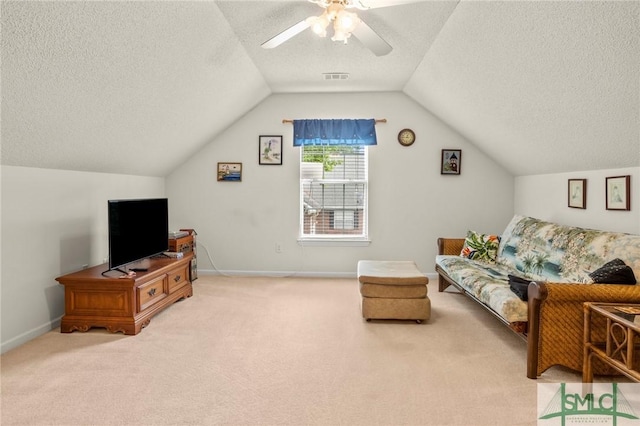 330 Central Ave, Guyton, GA 31312 - living room featuring a textured ceiling, carpet floors, vaulted ceiling, ceiling fan, and baseboards