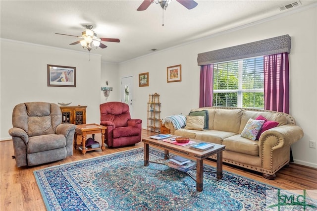 330 Central Ave, Guyton, GA 31312 - living room featuring ceiling fan, wood finished floors, ornamental molding, and baseboards