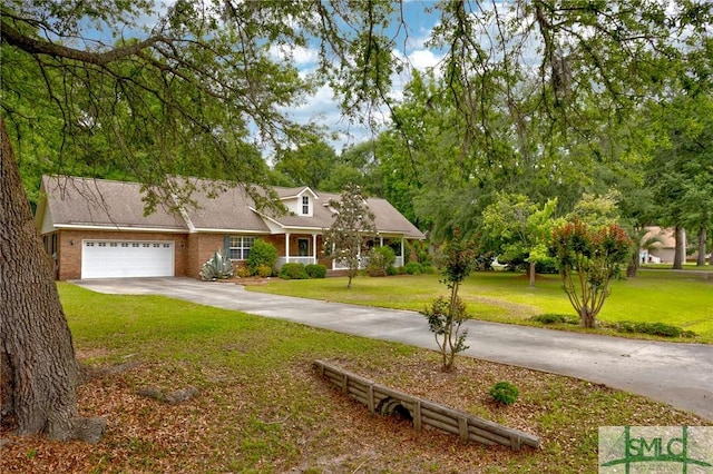330 Central Ave, Guyton, GA 31312 - view of front facade with a garage, concrete driveway, a front lawn, and brick siding