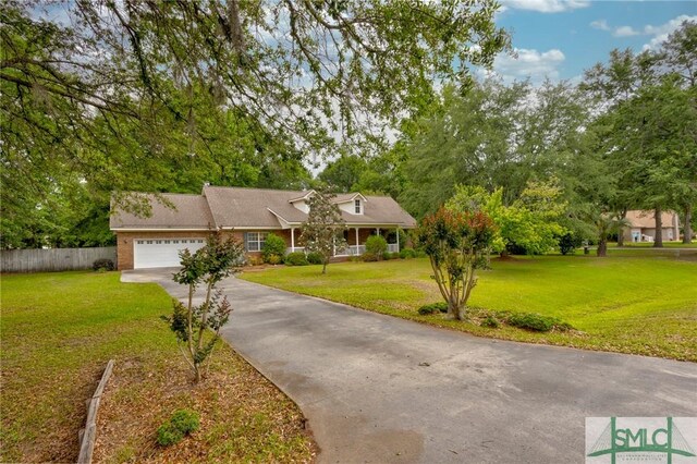 330 Central Ave, Guyton, GA 31312 - view of front facade with a garage, driveway, and covered porch
