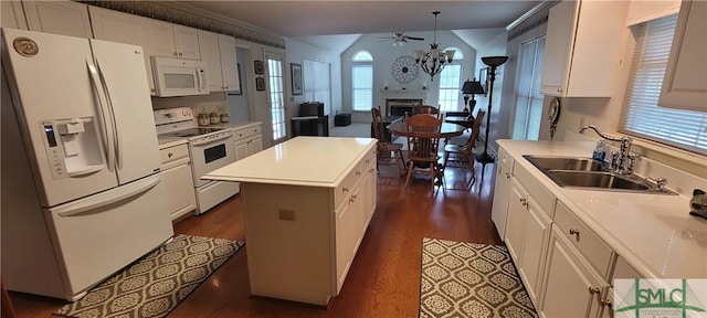 131 Farringdon Cir, Savannah, GA 31410 - kitchen featuring white appliances, a sink, dark wood-style flooring, a center island, and ornamental molding