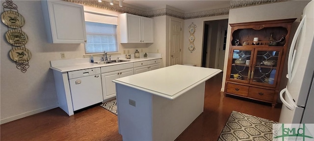 131 Farringdon Cir, Savannah, GA 31410 - kitchen featuring a sink, white appliances, dark wood-style floors, light countertops, and baseboards