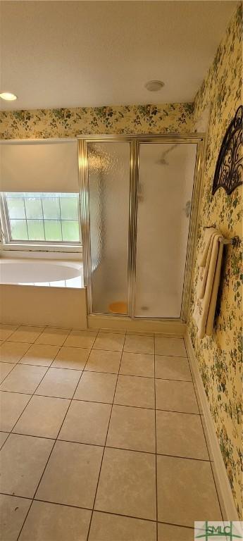 131 Farringdon Cir, Savannah, GA 31410 - bathroom with wallpapered walls, tile patterned flooring, a stall shower, and a bath