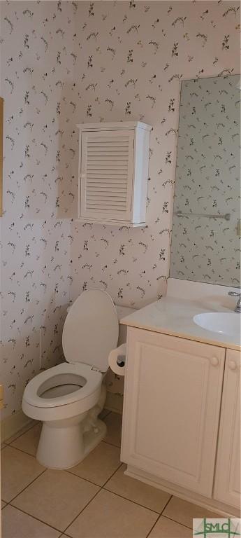 131 Farringdon Cir, Savannah, GA 31410 - half bath with wallpapered walls, tile patterned flooring, toilet, and vanity