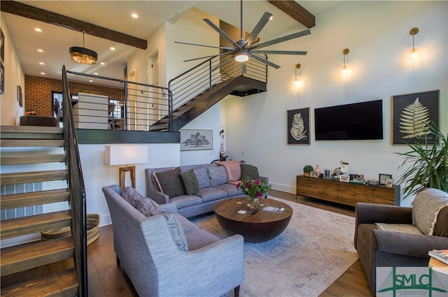 456 Port St, Savannah, GA 31401 - living area with stairs, a high ceiling, beamed ceiling, wood finished floors, and recessed lighting