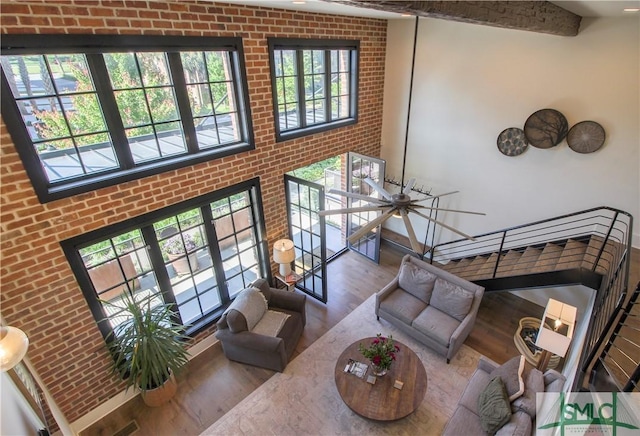 456 Port St, Savannah, GA 31401 - living area with brick wall and wood finished floors