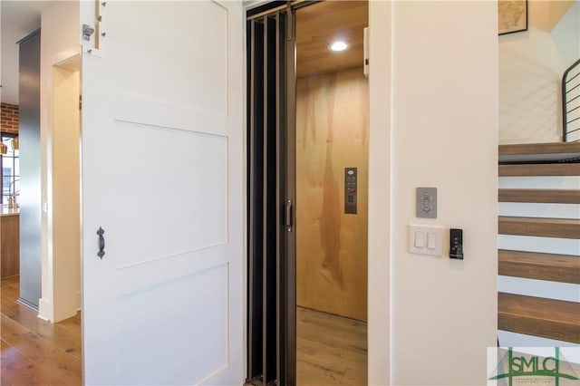 456 Port St, Savannah, GA 31401 - hall with wood finished floors, recessed lighting, elevator, and stairway