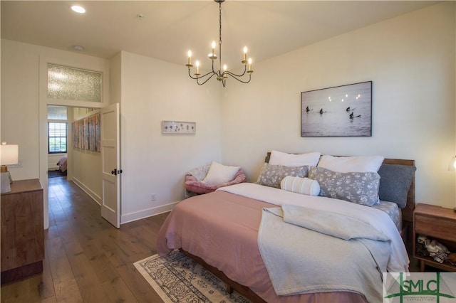 456 Port St, Savannah, GA 31401 - bedroom with a chandelier, dark wood-style floors, and baseboards