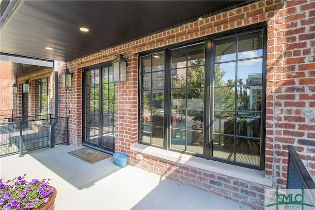 456 Port St, Savannah, GA 31401 - view of exterior entry featuring brick siding and covered porch