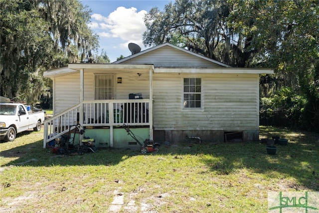 3808 Elmdale Ave, Savannah, GA 31405 - view of front facade with a front yard and crawl space