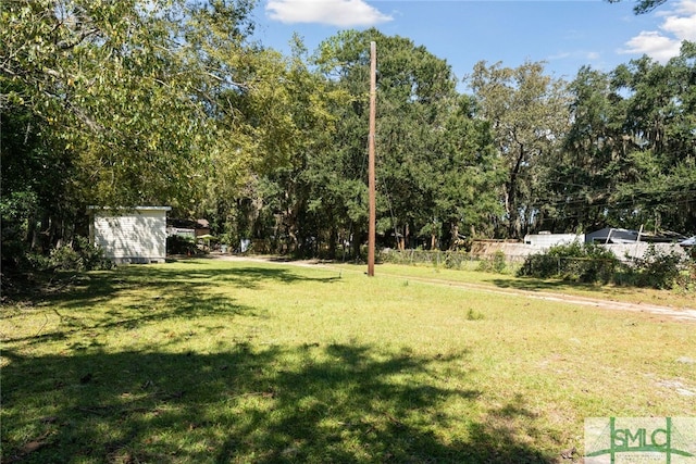 3808 Elmdale Ave, Savannah, GA 31405 - view of green lawn with an outdoor structure