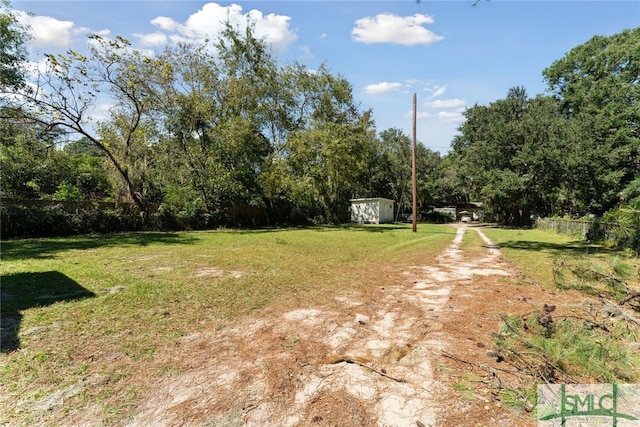 3808 Elmdale Ave, Savannah, GA 31405 - view of yard featuring a storage shed and an outdoor structure