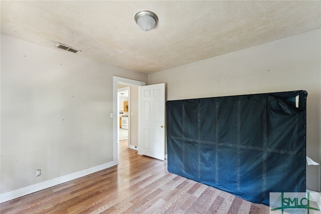 3808 Elmdale Ave, Savannah, GA 31405 - unfurnished bedroom featuring wood finished floors and baseboards