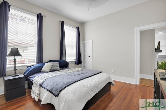 412 E 40th St E, Savannah, GA 31401 - bedroom with hardwood / wood-style floors, baseboards, and ceiling fan