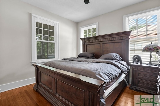 412 E 40th St E, Savannah, GA 31401 - bedroom with dark wood-type flooring, baseboards, and a ceiling fan