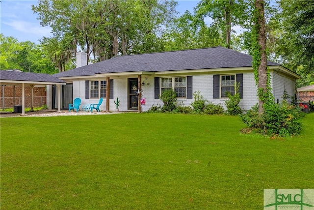 81 Quail Ln, Richmond Hill, GA 31324 - ranch-style home with brick siding, a chimney, and roof with shingles