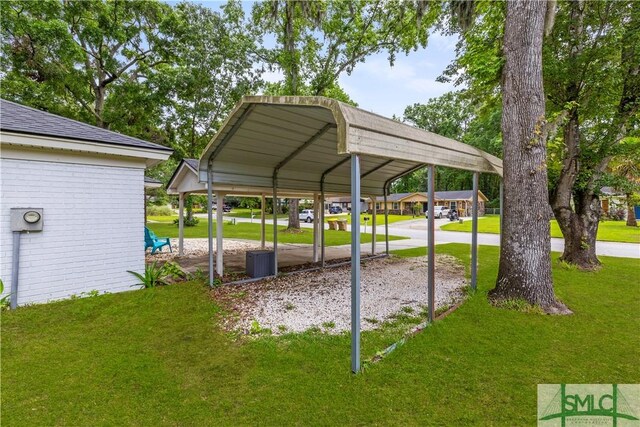 81 Quail Ln, Richmond Hill, GA 31324 - view of parking featuring a carport