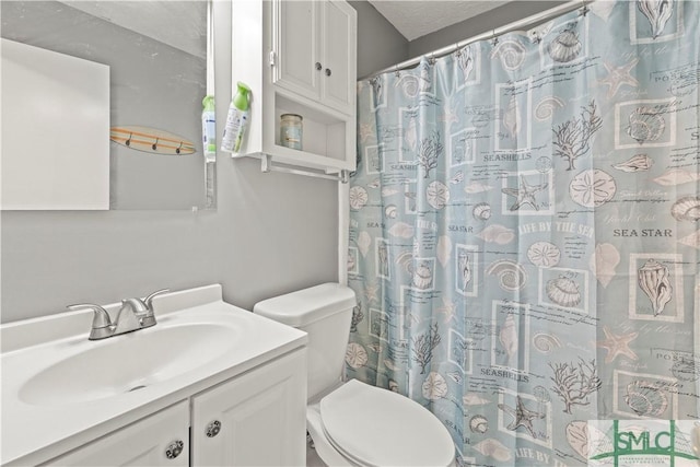 81 Quail Ln, Richmond Hill, GA 31324 - bathroom with toilet, vanity, and curtained shower