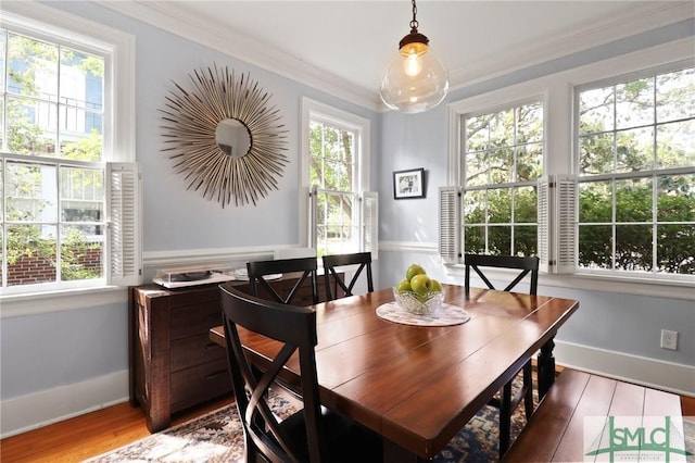 405 E 55th St, Savannah, GA 31405 - dining room featuring wood finished floors, ornamental molding, and baseboards