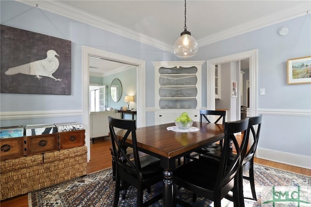 405 E 55th St, Savannah, GA 31405 - dining space featuring ornamental molding and wood finished floors