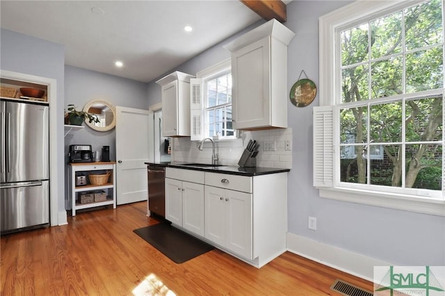 405 E 55th St, Savannah, GA 31405 - kitchen with stainless steel appliances, a sink, plenty of natural light, wood finished floors, and recessed lighting