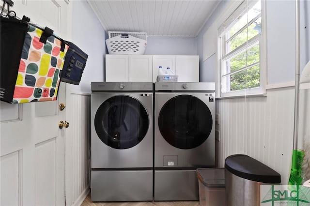405 E 55th St, Savannah, GA 31405 - laundry room featuring washer and clothes dryer, cabinet space, wooden ceiling, and light wood-style floors