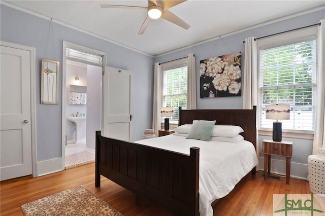 405 E 55th St, Savannah, GA 31405 - bedroom featuring wood finished floors, ornamental molding, connected bathroom, and ceiling fan
