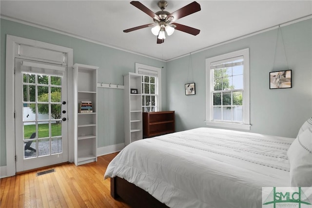 405 E 55th St, Savannah, GA 31405 - bedroom with crown molding, wood-type flooring, access to exterior, and a ceiling fan